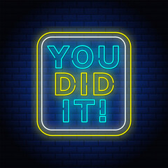 You did it neon text sign in brick background.