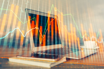 Stock market graph and table with computer background. Multi exposure. Concept of financial analysis.