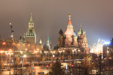 Fototapeta premium Moscow, Russia, Kremlin. St. Basil's catherdral, Spasskaya tower, Kremlin wall in night. View from Zaryadye park.