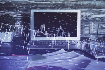 Double exposure of forex chart and work space with computer. Concept of international online trading.