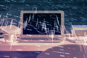 Financial chart drawing and table with computer on background. Multi exposure. Concept of...