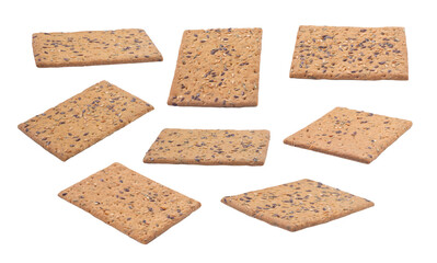Flying crisp breads with seeds and spices isolated on white background
