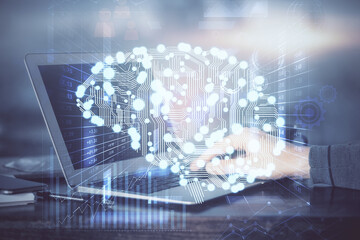 Man typing on keyboard background with brain hologram. Concept of big Data. Double exposure.