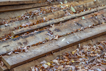 Heap of long wooden boards for the construction and improvement of the yard