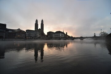 Grossmünster and Limmatquai in the morning hours in winter at sunrise