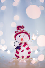 happy snowman with a firework and bokeh