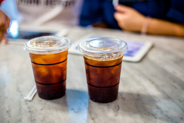 A blurred background view of the current coffee shop menu ordering by customers to select through the tap and click order, modern technology and ease of use.