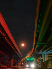 Garbage truck underneath the main highway in Bangkok city, Thailand.