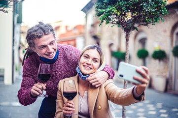 Happy millennial lovers enjoying lunch together at restaurant patio - Young couple in love with...