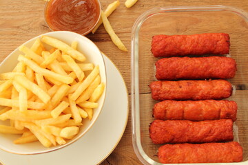 delicious french fries with cevapcici rolls and dip
