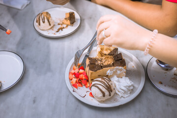 Blurred background view Of the dessert menu (Honey Toast) that contains ice cream, whipped cream, sour fruit like strawberries to be decorated and served to the customer.