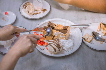 Blurred background view Of the dessert menu (Honey Toast) that contains ice cream, whipped cream, sour fruit like strawberries to be decorated and served to the customer.