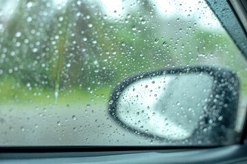 The background of rainwater drops on the glass, the waterless wallpaper on the white surface, is...