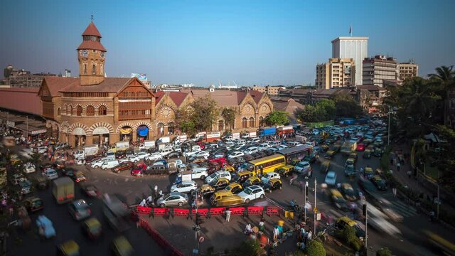 Time lapse view of rush hour traffic outside historical landmark Crawford Market in Mumbai, Maharashtra, India.	
