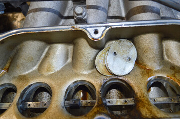 Close-up of the removed intake manifold of a car engine