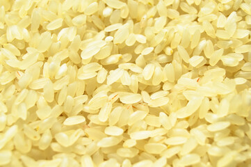 Fresh organic white raw rice grains texture, uncooked rice background