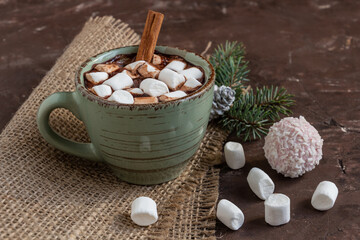 atmospheric Christmas composition, a cup of cocoa with marshmallows, gingerbread cookies, sweets, cinnamon, copy space..