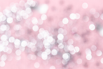 Festive Christmas abstract background. White and gray bokeh lights on pink pastel background.