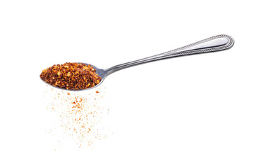  pepper powder spice in stainless steel spoon on white background