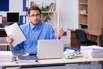 Young male bookkeper in budget planning concept