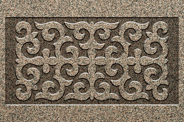 Ornamental print on the stone surface. Vintage ornament on the stone. Close-up seamless texture. Stone texture. Pattern on the stone. Embossed pattern. Wallpaper.
