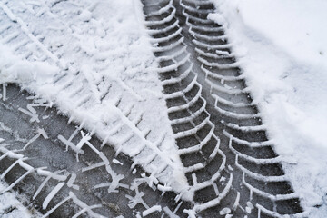 track from car tires on snow