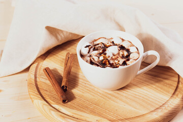 tasty sweet hot chocolate in a cup and mini marshmallows