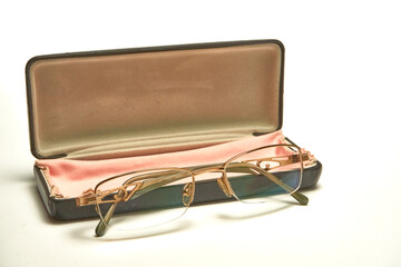 Glasses in a case on a light background.