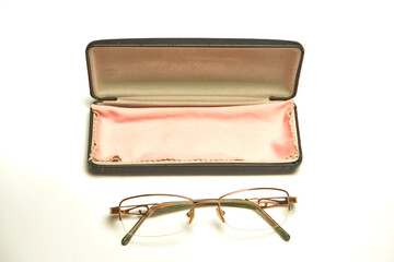 Glasses in a case on a light background.