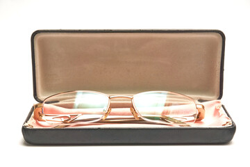 Glasses in a case on a light background.