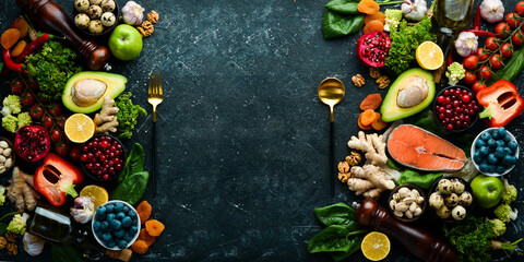 Fototapeta na wymiar Balanced diet: vegetables, fruits, nuts and other dietary foods. Top view. Free copy space.