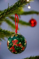 christmas tree decorations in green and red berries