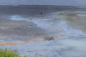 Shoreline of Lake Oyunama, mud and traces of sulfur, hot springs of Noboribetsu