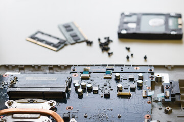 Laptop disassembling parts and devices on white background, laptop repair
