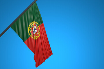 3D illustration of the national flag of Portugal on a metal flagpole fluttering against the blue sky.Country symbol.