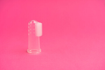 Compact toothbrush fingertip. Travel hygiene close up
