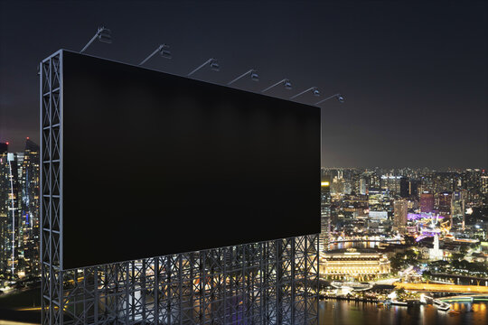 Blank black road billboard with Singapore cityscape background at night time. Street advertising poster, mock up, 3D rendering. Side view. The concept of marketing communication to sell idea.