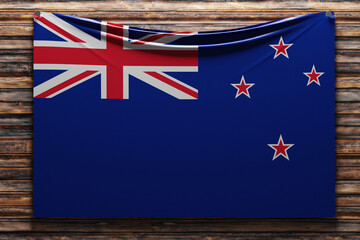 3D illustration of the national   fabric flag of New Zealand  nailed on a wooden wall .Country...