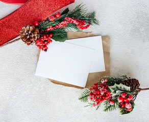 Blank card on white background with spruce branch. Flat lay composition with copy space.
