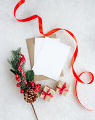 Blank greeting card with spruce branch on white background. Christmas and New Year composition.
