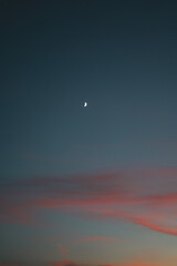 Crescent moon after sunset on a beautiful sky