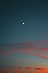 Crescent moon after sunset on a beautiful sky