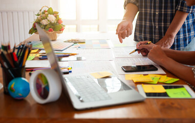 Designers discuss how to draw up the content layout of the website and mobile app.