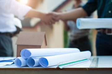 Concept of architects and engineering cooperation to plan construction projects.