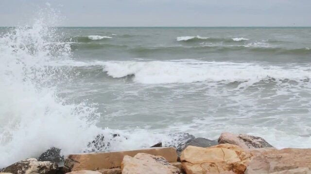 Waves breaking on the rocks on a windy, winter day