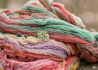 colored wool yarn skeins on a fuzzy background, handicraft concept, hand knitting, autumn time, handicrafts
