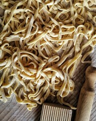 pasta on the table with a rolling pin
