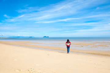 Fototapeta na wymiar Lonely Woman On Deserted Beach