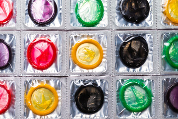 Colorful condoms background.