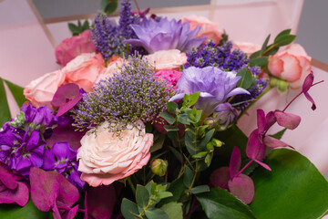 Bouquet of  soft pink flowers in wrapping paper.